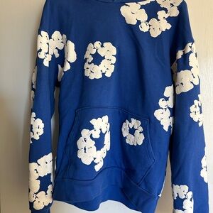 Denim Tears blue hoodie with white puffy flowers
